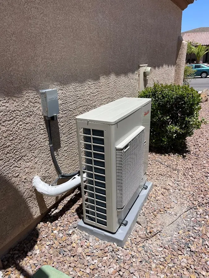 Residential air conditioning condenser unit in Laie